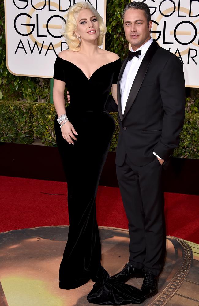 Lady Gaga and Taylor Kinney arrive at the 73rd annual Golden Globe Awards.