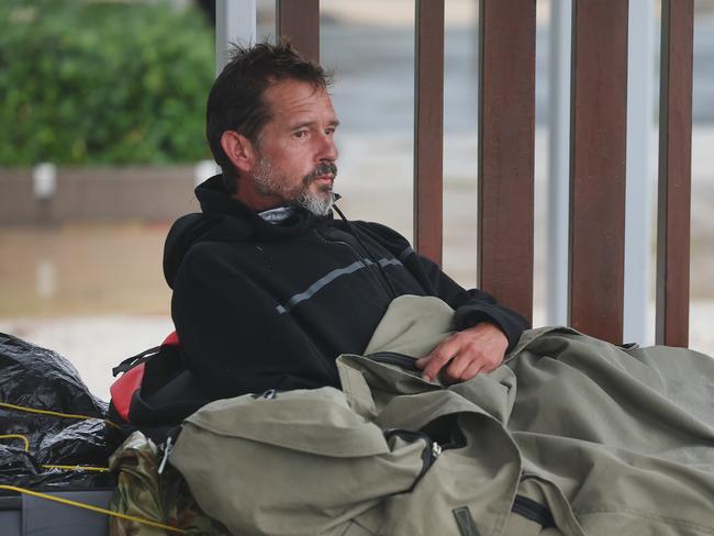 Gold Coast starting to feel the wrath of Cyclone Alfred, lur king just off the coast. Homeless man Nico Jones shelters from the weather in his swag at Surfers Paradise. Picture Glenn Hampson