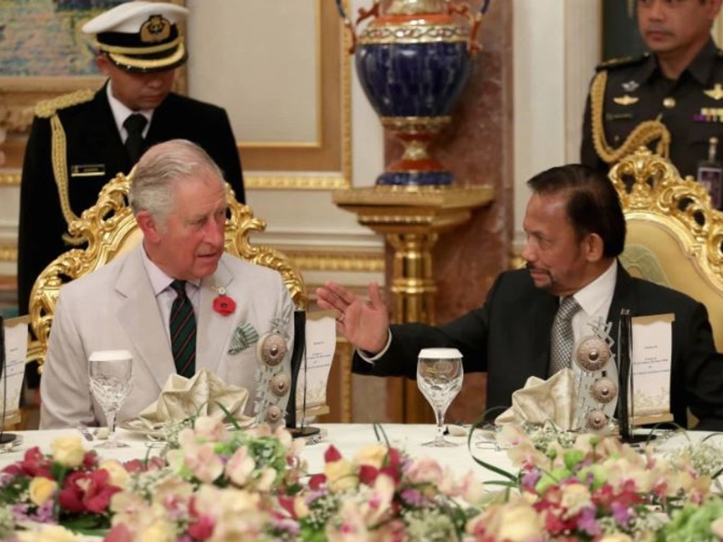 The sultan enjoys high tea with Prince Charles at the palace in 2017.