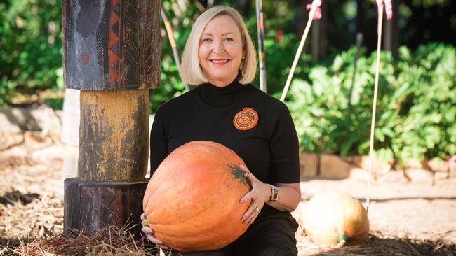 NT Administrator Vicki O'Halloran with the pumpkin that Government House entered into the 2020 Royal Darwin Show. Picture: Glenn Campbell