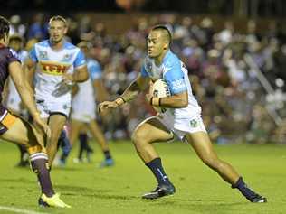 IN ACTION: Gold Coast Titans player Philip Sami runs at the Brisbane Broncos defence during their recent trial game in Toowoomba. Sami has been named in the Titans sides for this weekend's NRL match at Clive Berghofer Stadium. Picture: Kevin Farmer