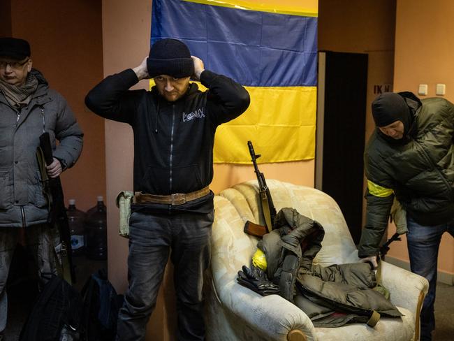 Members of a Territorial Defence unit prepare to deploy to various parts of the city in Kyiv, Ukraine. Picture: Getty Images