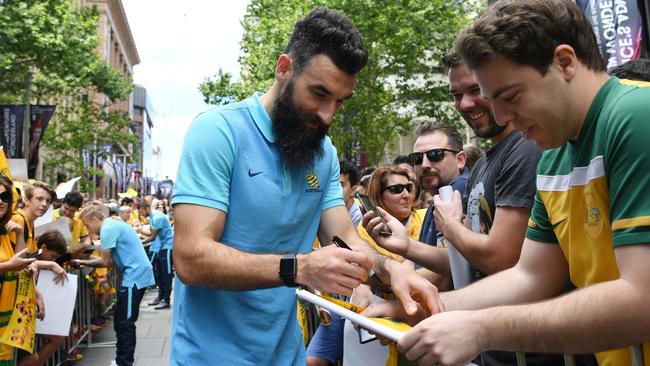 Jedinak signing autographs. Picture: AAP