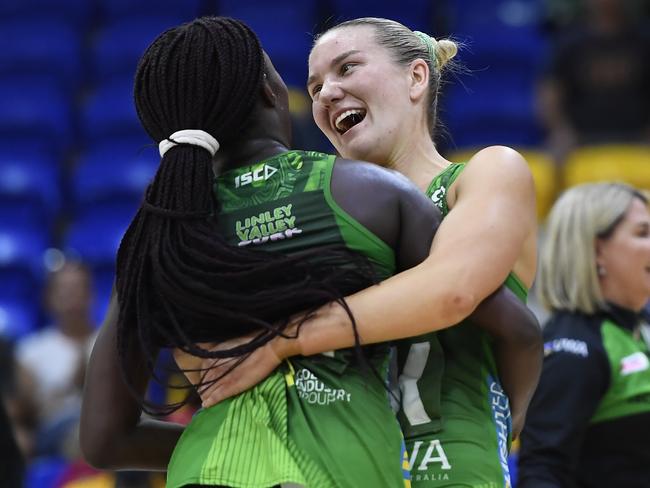 SUNSHINE COAST, AUSTRALIA - OCTOBER 04: Courtney Bruce of the Fever celebrates with Sunday Aryang after their victory during the Super Netball Minor Semi Final match between the West Coast Fever and the NSW Swifts at Sunshine Coast Stadium on October 04, 2020 in Sunshine Coast, Australia. (Photo by Albert Perez/Getty Images)