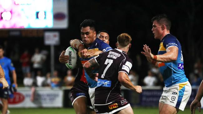 Gold Coast Titans player Herman Ese'ese is caught in a tackle by Burleigh Bears player Pat Politoni during a pre-season trial at Pizzey Park. February 20, 2021. Photo Jason O'Brien