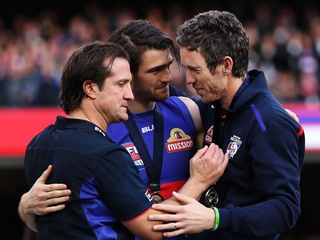 Bob sharing an emotional moment with coach Luke Beveridge and Easton Wood after the Bulldogs’ flag win. Picture: Phil Hillyard