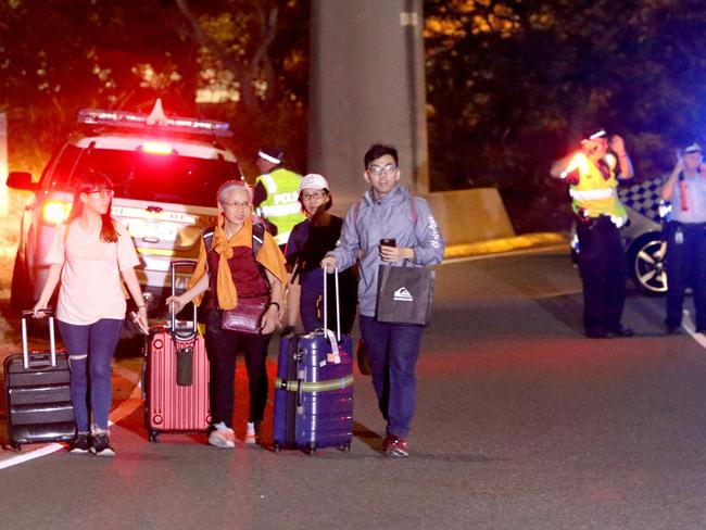 Stranded passengers and loved ones at Brisbane Airport’s international terminal. Picture: Steve Pohlner/AAP