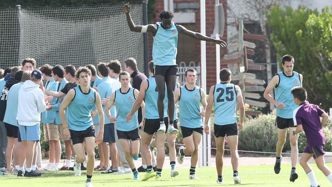 Ben Rongdit shows off his hops in the warm-up for Geelong Grammar. Picture: Alan Barber