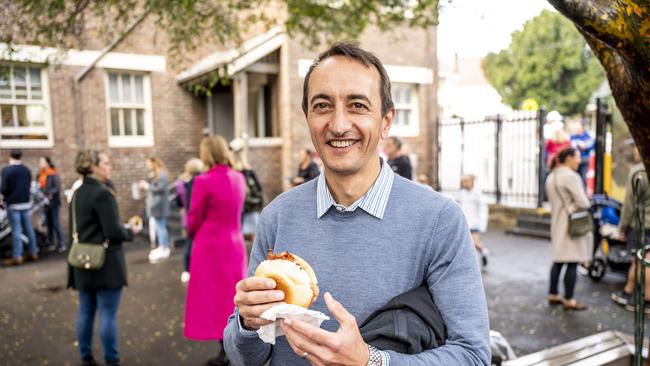 Dave Sharma enjoys his egg and bacon roll. Picture: Darren Leigh Roberts