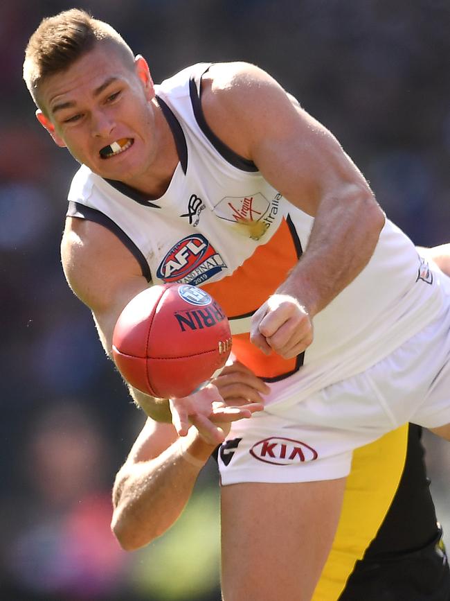 Adam Tomlinson and his orange, white and charcoal mouthguard. Picture: Getty