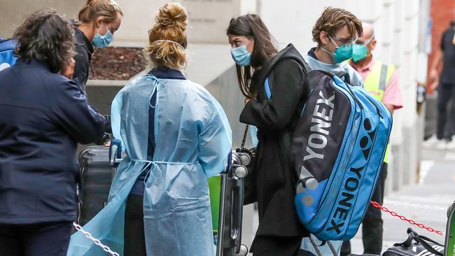 A passenger on one of the Australian Open chartered flights arrives at a Melbourne quarantine hotel. Picture: Tim Carrafa