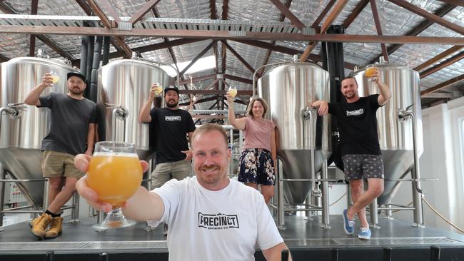 Precinct Brewing’s owners Jeremy James, Michael Craighead, Scott Imlach, Simone Tunbridge and Tom Welch toast the opening. Picture: Glenn Hampson