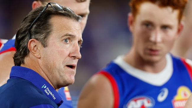 MELBOURNE, AUSTRALIA - MAY 05: Luke Beveridge, Senior Coach of the Bulldogs addresses his players at three quarter time during the 2024 AFL Round 08 match between the Western Bulldogs and the Hawthorn Hawks at Marvel Stadium on May 05, 2024 in Melbourne, Australia. (Photo by Dylan Burns/AFL Photos via Getty Images)