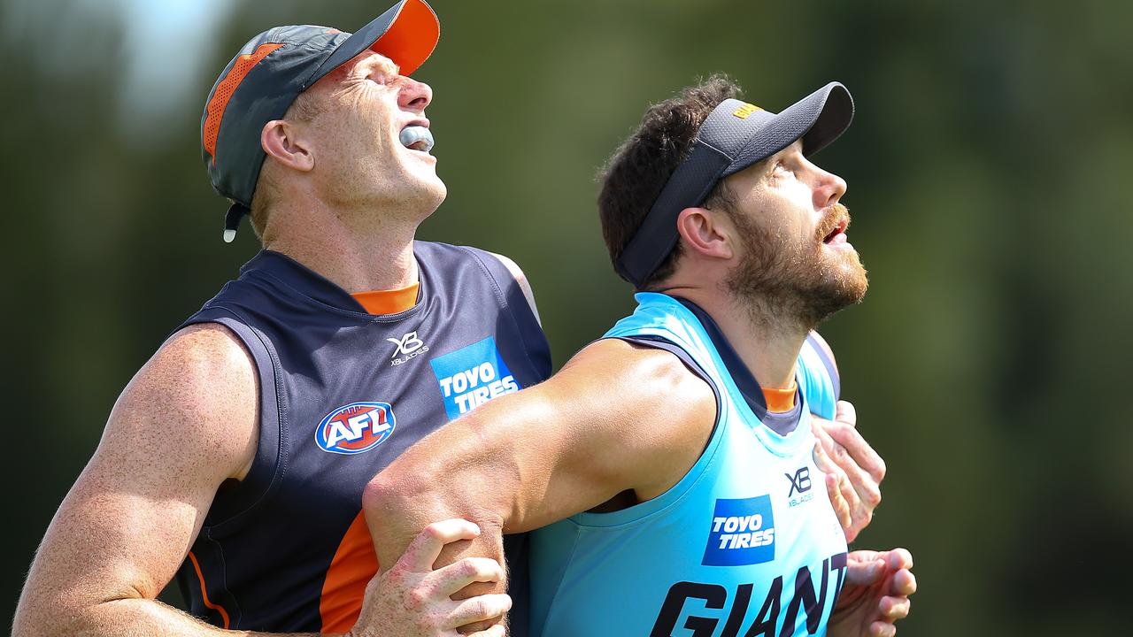 Sam Jacobs (left) competes with Shane Mumford at Giants training.