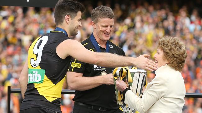 Maureen Hafey presents the premiership cup to Trent Cotchin and Damien Hardwick. Picture: Michael Klein.