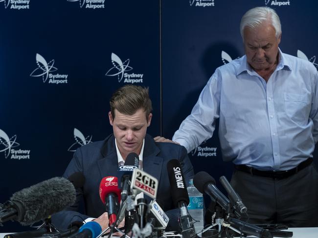 An emotional Steve Smith is comforted by his father Peter Picture: Brook Mitchell/Getty Images