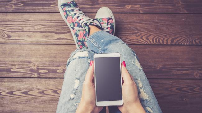 Generic photo of girl with a phone, for SA Weekend column by Mark Dapin. Picture: iStock