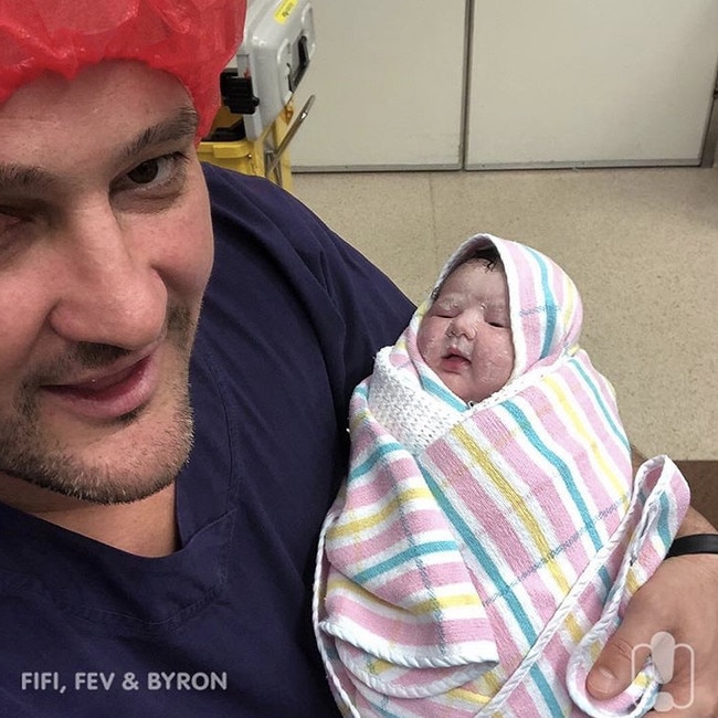 Brendan Fevola holds Tobi.