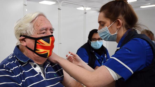 Robert Williams, 84, receives an injection of the Oxford/AstraZeneca COVID-19 vaccine in Epsom, southern England, on Monday. Picture: AFP