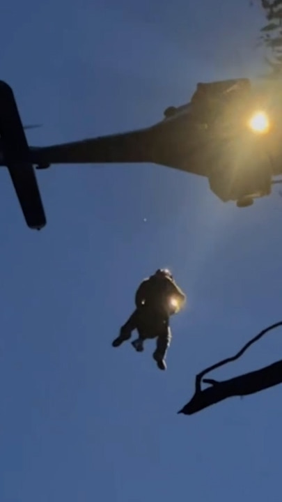 A paraglider was winched to safety after becoming stuck in a tree at Corryong earlier this week