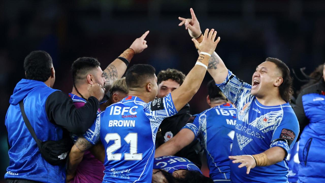 Josh Papalii and his Samoa teammates celebrate after their win over England. Picture: Getty Images