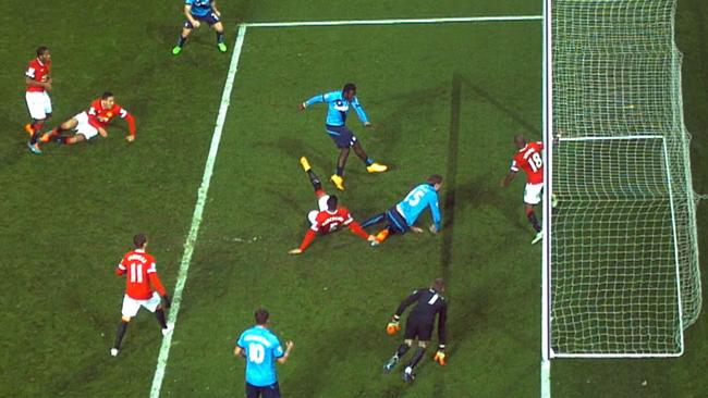 Ashley Young clears Mame Biram Diouf’s shot off the line to save Manchester United.