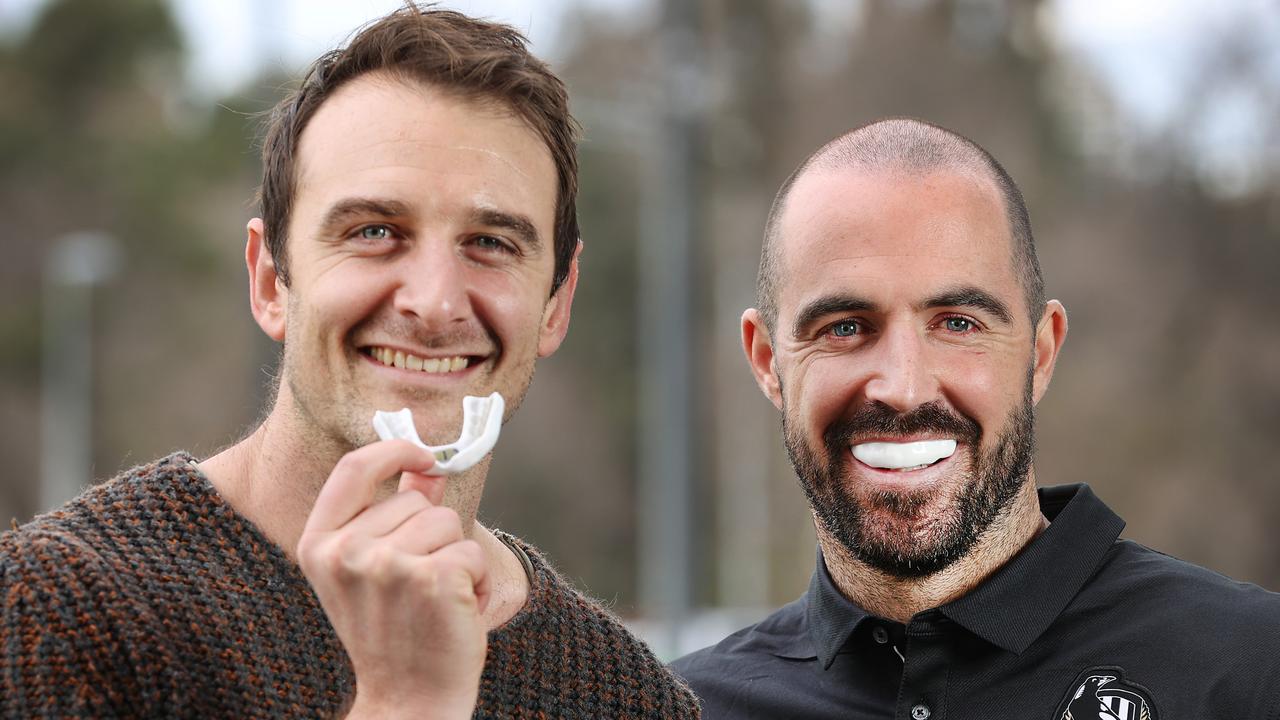 AFL players Jobe Watson and Steele Sidebottom with the smart mouthguard. Picture: David Caird