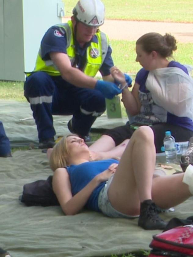 Two women are treated by paramedic. Picture: TNV