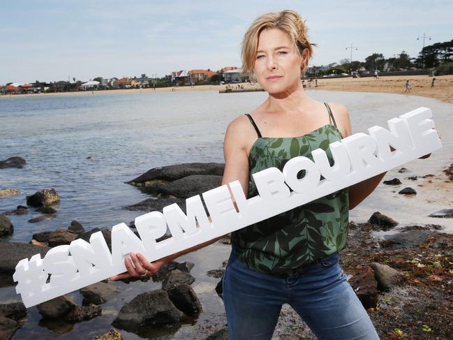 Photo of 'Wentworth' actor Libby Tanner holding the Snap Melbourne sign. at Williamstown beach. #SnapMelbourne Picture: Mark Wilson