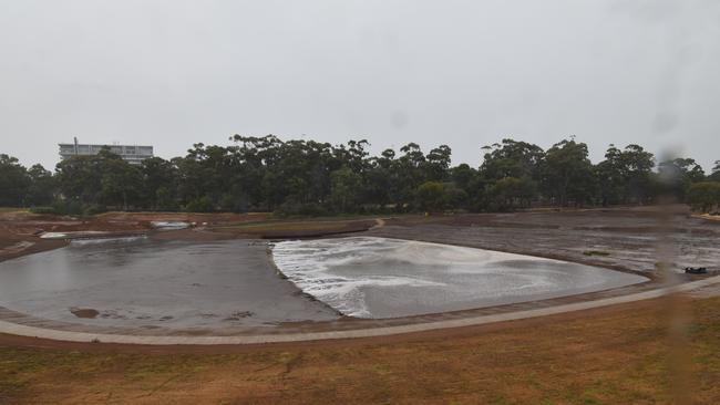 The new Victoria Park wetlands are filled by the unseasonal heavy rain which fell across South Australia. Picture: Saturday 22/01/21 4.30pm / Brown Hill Keswick Creek Stormwater Project