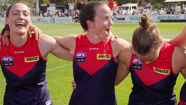 Daisy Pearce enjoys a win with her Melbourne teammates.