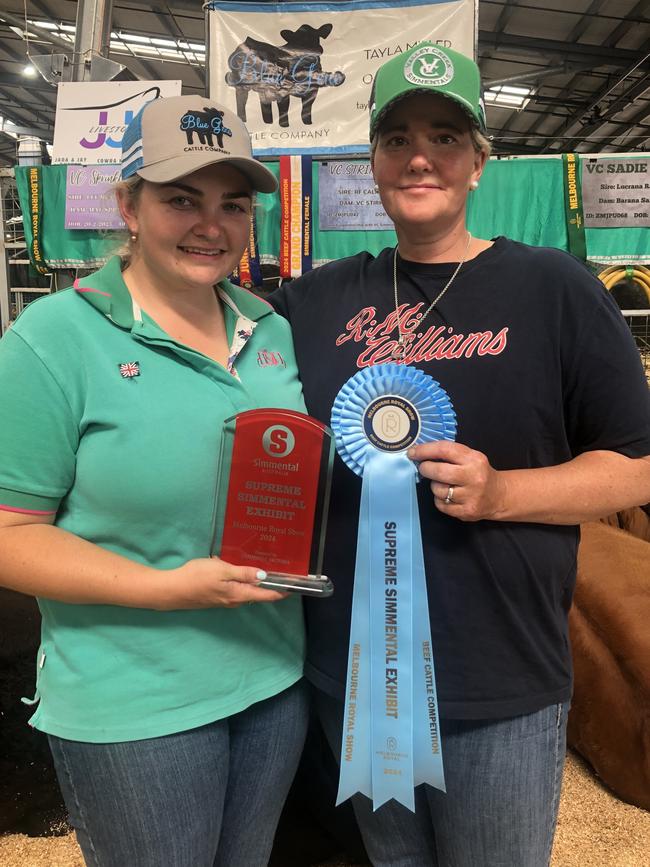 Tayla Harris and Samantha Moeck with the winning ribbon and trophy. Picture: Conor Fowler