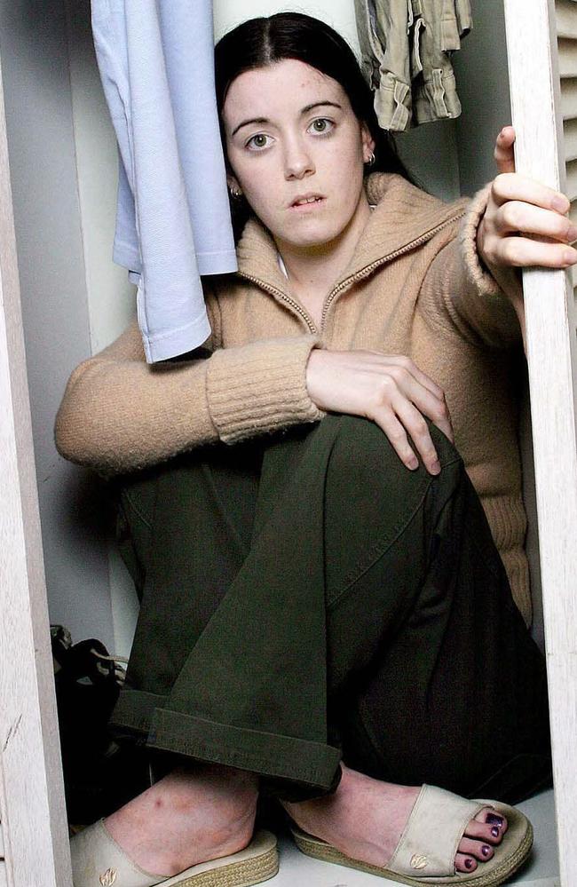 Natasha Ryan showing how she hid in a cupboard. Picture: News Corp