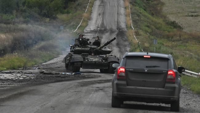 Ukrainian soldiers man a tank on the outskirts of Izyum in eastern Ukraine. Picture: AFP