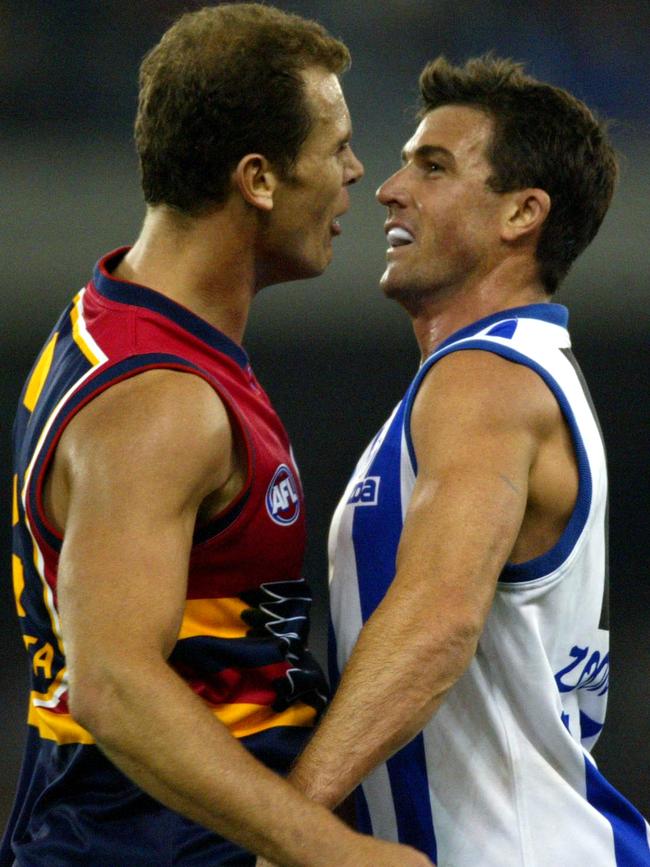 Wayne Carey clashes with former teammate Anthony Stevens in 2003.