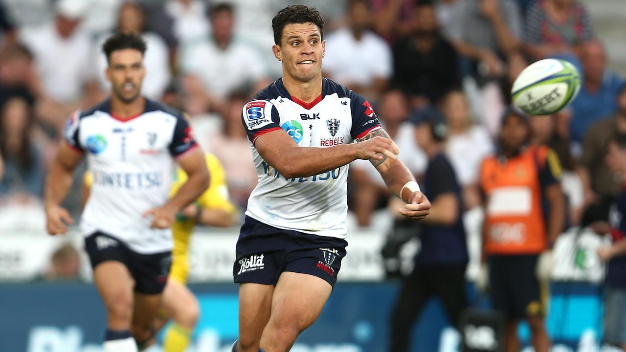 Matt To’omua of the Rebels passes at Forsyth Barr Stadium.