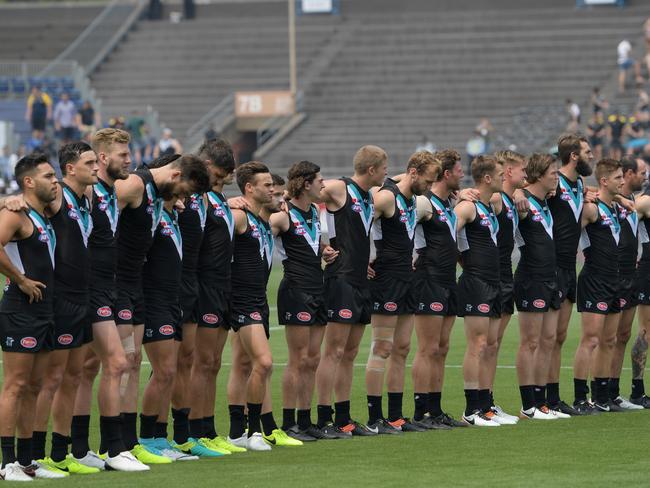 Port players sing the nation anthem during the round 8 match the Gold Coast Suns and Port Adelaide at Jiangwan Stadium in Shanghai, China, Sunday, May 14, 2017. (AAP Image/Tracey Nearmy) NO ARCHIVING, EDITORIAL ONLY