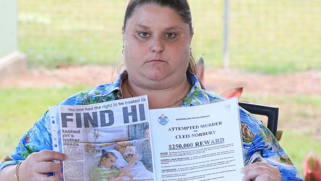 Cleis Norbury pictured with a press cutting of when she was recovering in hospital from the bashing and a reward document. Cleis was severely bashed 20 years ago with no one charged for the attempted murder. Picture: Justin Brierty