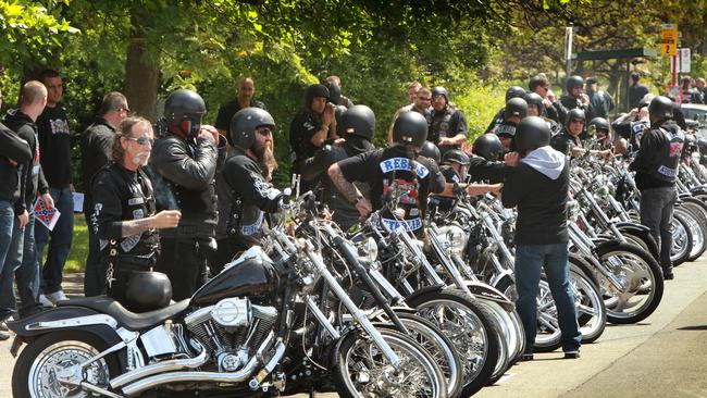 Rebels motorcycle club members take off their helmets.