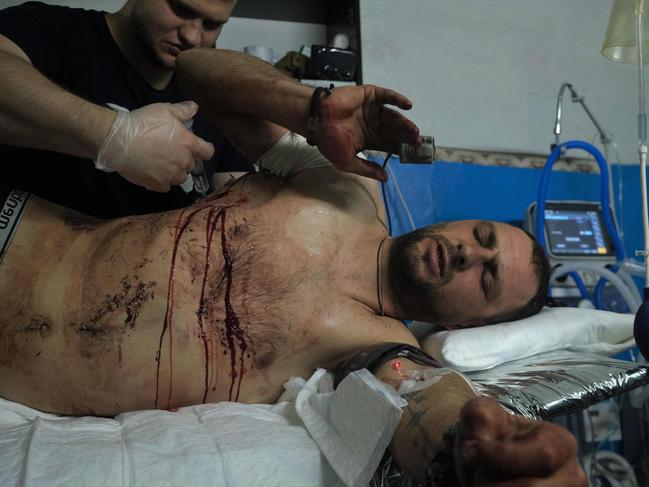 A wounded Ukrainian serviceman receives treatment near Bakhmut amid the Russian invasion of Ukraine. Picture: AFP