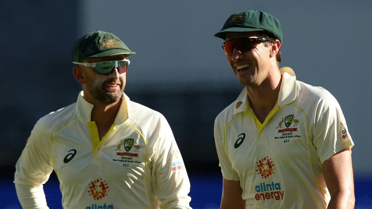 Nathan Lyon (L) and Pat Cummins both reached milestones in Perth. Picture: Colin Murty/AFP