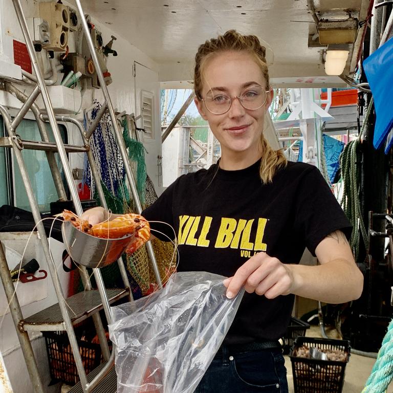 Local Amy Bake on the C-Titan serving up freshly caught prawns, Main Beach. Picture: JENNY MASTERS