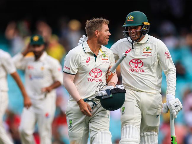 David Warner and Usman Khawaja leave the field at stumps. Picture: Mark Evans/Getty Images