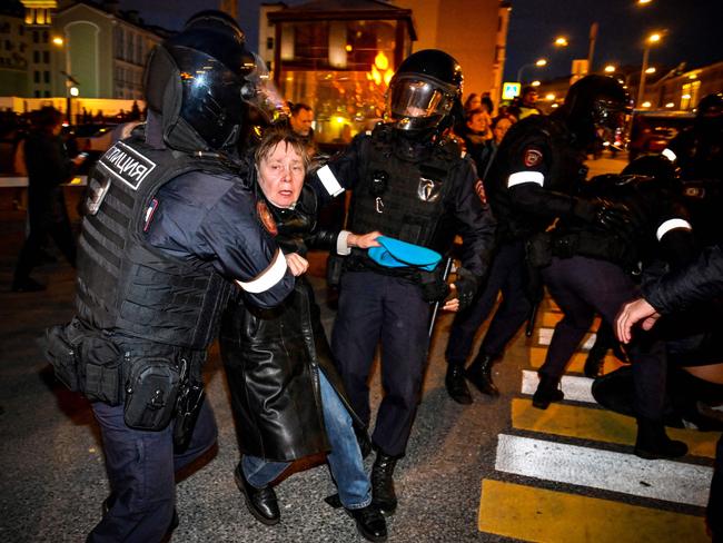 Police officers detain a woman in Moscow. Picture: AFP