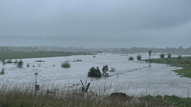 The Campaspe River has spilt over onto farmland near Kyneton. Rain is coming down hard on the Calder Freeway and the wind is picking up. Picture: Hayley Elg.