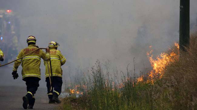 Firefighters work on a controlled burn in Koorainghat, South of Taree in NSW, Monday, November 11, 2019. Picture: AAP/Darren Pateman