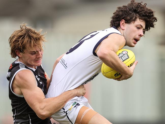 BALLARAT, AUSTRALIA - JUNE 06: Nick Hodgson of the Rebels tackles Jak Tute of the Falcons during the NAB League match between the GWV Rebels and the Geelong Falcons at Mars Stadium on June 6, 2021 in Ballarat, Australia. (Photo by Martin Keep/Getty Images)