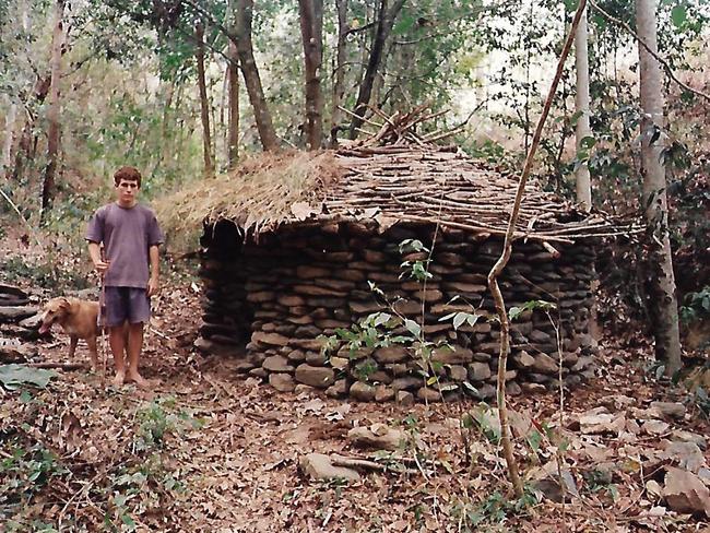 John beside a stone hut he built entirely by himself at about 14 years of age.