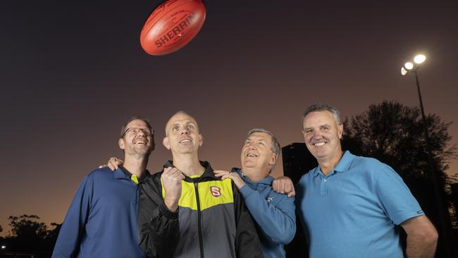 Corey Bowen (second from left) hams it up at training with SANFL 400-game field umpires and South Australian Football Hall of Fame members, from left, Tim Pfeiffer, Laurie Argent and Richard Williams. Picture: Brett Hartwig