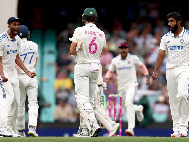 Indiaâs captain Jasprit Bumrah (R) reacts towards Australiaâs Sam Konstas (C) after dismissing Australiaâs Usman Khawaja during day one of the fifth Test match between Australia and India at the Sydney Cricket Ground on January 3, 2025. (Photo by DAVID GRAY / AFP) / -- IMAGE RESTRICTED TO EDITORIAL USE - STRICTLY NO COMMERCIAL USE --